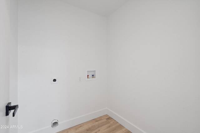 washroom with washer hookup, hardwood / wood-style floors, and electric dryer hookup