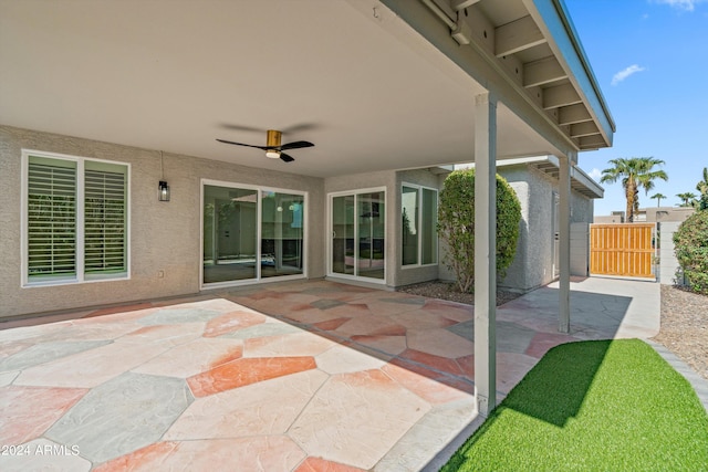 view of patio featuring ceiling fan