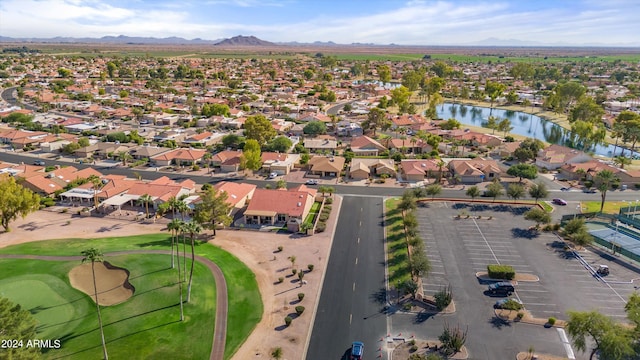 drone / aerial view with a water and mountain view