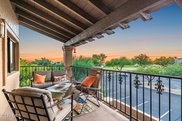 view of balcony at dusk