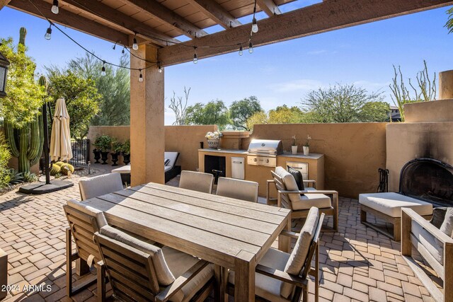 view of patio / terrace featuring exterior kitchen and area for grilling