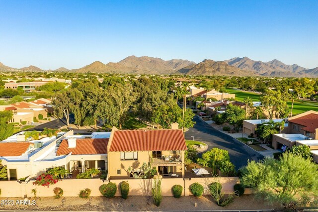 birds eye view of property featuring a mountain view