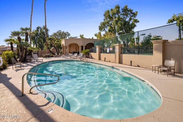 view of swimming pool with a patio