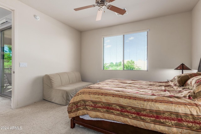 bedroom featuring ceiling fan, light colored carpet, and access to outside