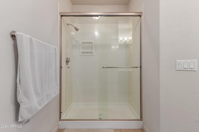 bathroom with an enclosed shower