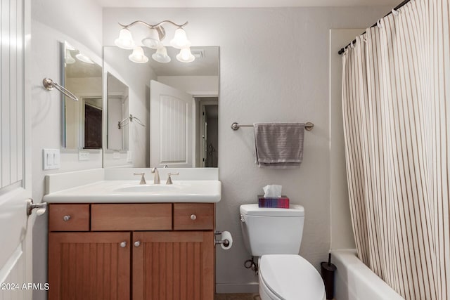 full bathroom with shower / tub combo with curtain, vanity, and toilet