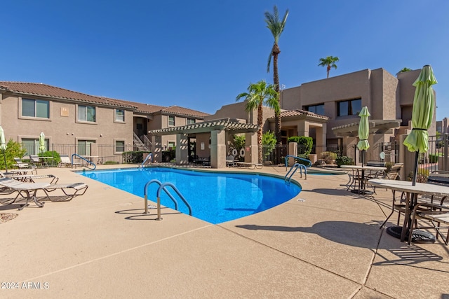 view of pool featuring a pergola and a patio