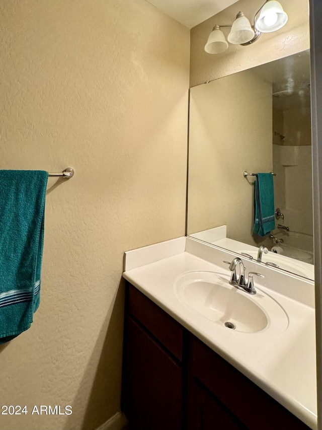 bathroom featuring vanity and tub / shower combination