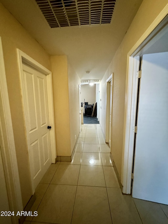 hallway with light tile patterned flooring