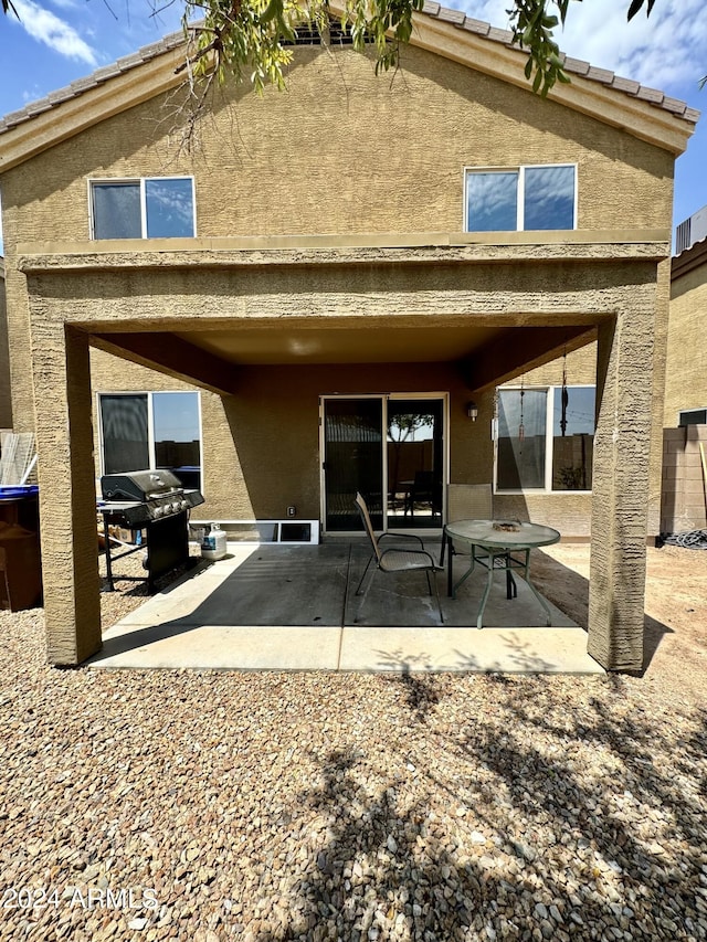 back of house featuring a patio area