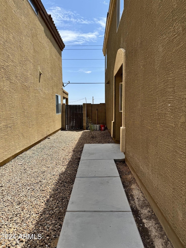 view of side of property with a patio area