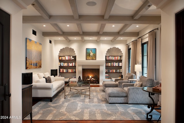 living area featuring coffered ceiling, beamed ceiling, and wood-type flooring