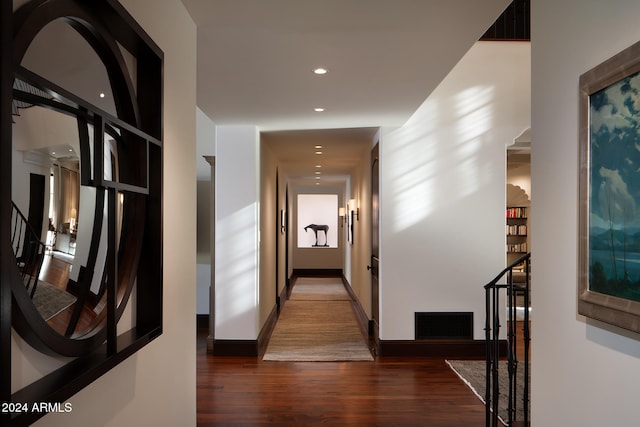 hallway featuring dark hardwood / wood-style floors