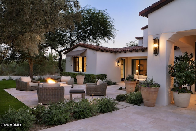 patio terrace at dusk with outdoor lounge area