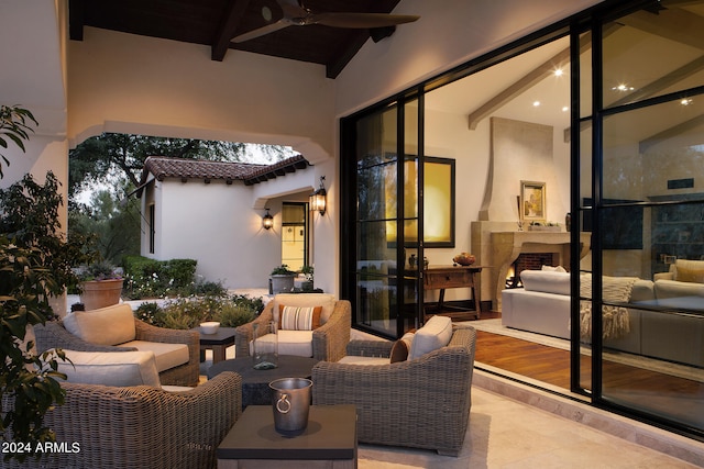 view of patio featuring ceiling fan and an outdoor living space