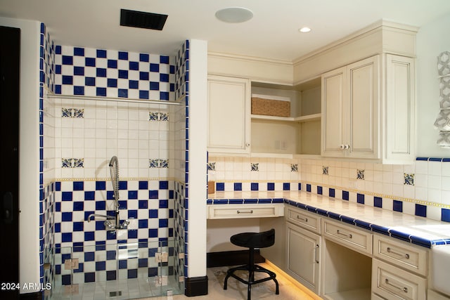 interior space with decorative backsplash and walk in shower