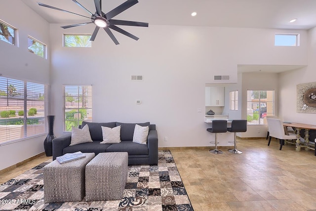 11333 N 92nd St Unit 1118, Scottsdale, AZ 85260 - living area with ceiling fan, plenty of natural light, and a high ceiling