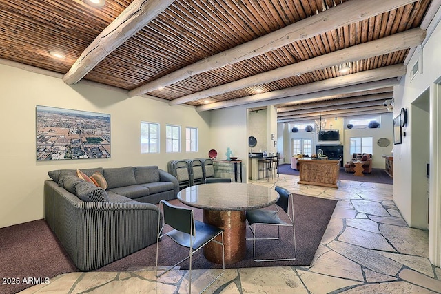 11333 N 92nd St Unit 1118, Scottsdale, AZ 85260 - living area with stone tile floors, recessed lighting, and a wooden ceiling with exposed beams