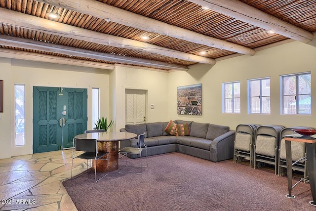 11333 N 92nd St Unit 1118, Scottsdale, AZ 85260 - living room featuring beam ceiling and stone tile flooring
