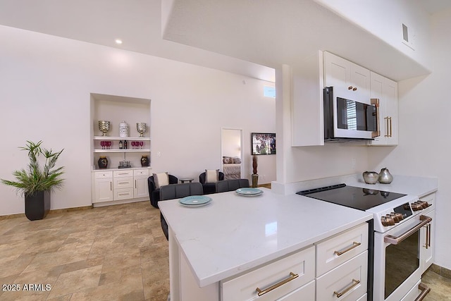 11333 N 92nd St Unit 1118, Scottsdale, AZ 85260 - kitchen featuring white appliances, white cabinetry, built in features, and stone finish flooring