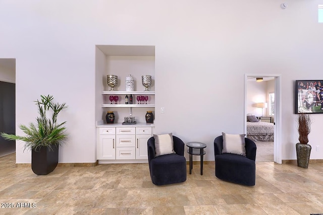 11333 N 92nd St Unit 1118, Scottsdale, AZ 85260 - living area with light stone finish flooring and baseboards