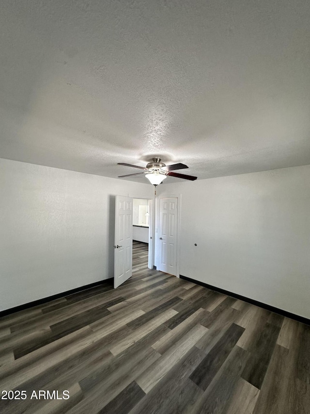 1214 E Henry St, Tempe, AZ 85288 - empty room featuring a ceiling fan, dark wood-type flooring, baseboards, and a textured ceiling