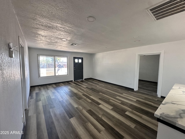 1214 E Henry St, Tempe, AZ 85288 - spare room with dark wood finished floors, a textured ceiling, and baseboards