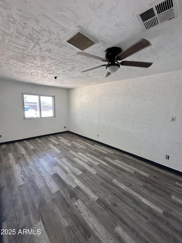 1214 E Henry St, Tempe, AZ 85288 - empty room featuring ceiling fan, a textured ceiling, dark wood-style flooring, and baseboards