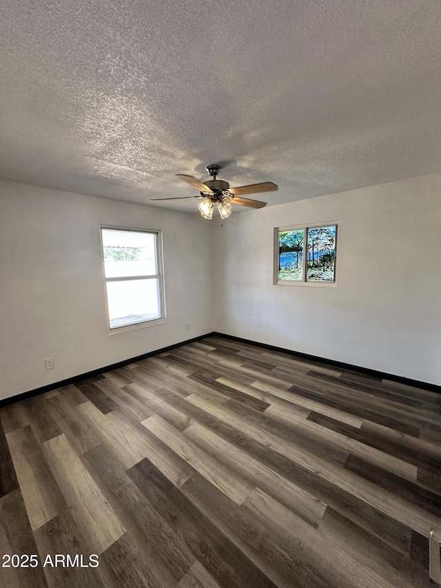 1214 E Henry St, Tempe, AZ 85288 - spare room with a textured ceiling, dark wood-type flooring, baseboards, and ceiling fan