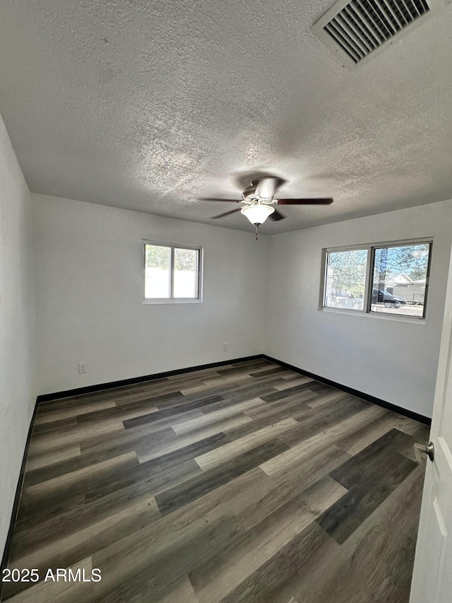 1214 E Henry St, Tempe, AZ 85288 - unfurnished room featuring a ceiling fan, wood finished floors, a textured ceiling, and baseboards