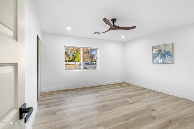 spare room with light hardwood / wood-style flooring and ceiling fan