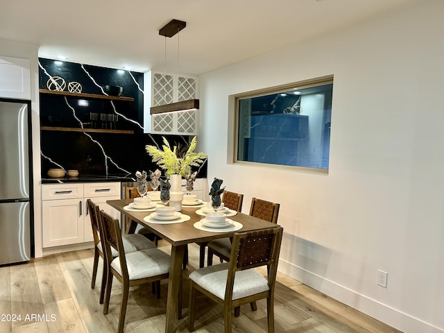 dining area with light wood-type flooring