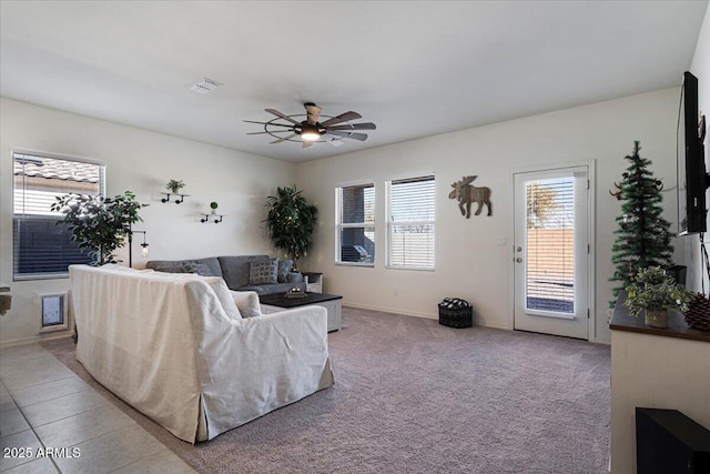 carpeted living room featuring ceiling fan