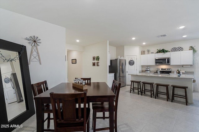 dining space with light tile patterned flooring