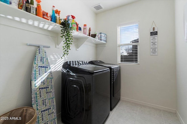 laundry area with washing machine and clothes dryer