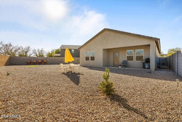 rear view of property with a patio