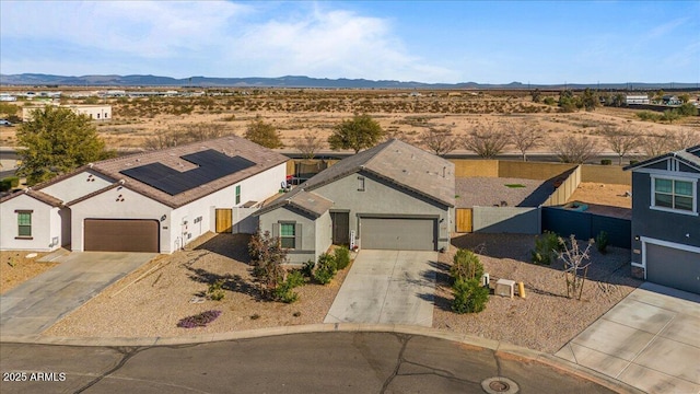 birds eye view of property with a mountain view