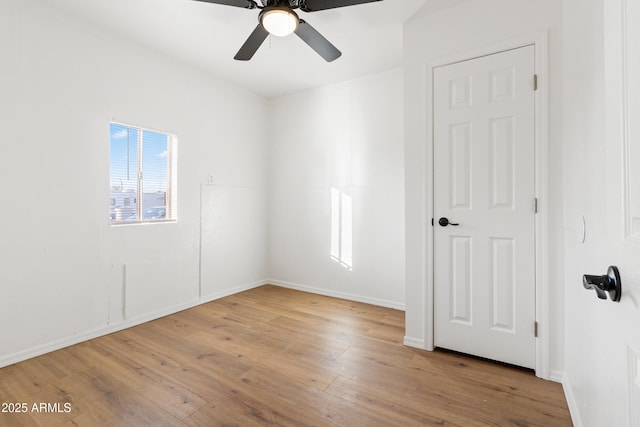 unfurnished room featuring ceiling fan and light hardwood / wood-style flooring