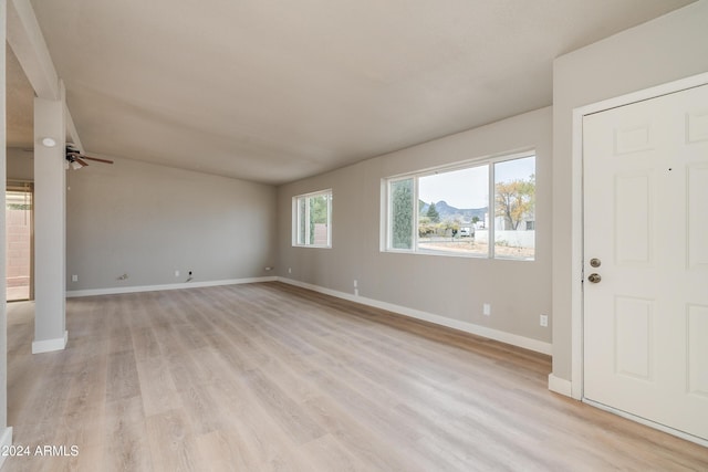 foyer with ceiling fan and light hardwood / wood-style floors