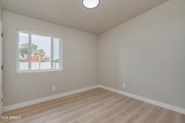 spare room featuring light hardwood / wood-style floors