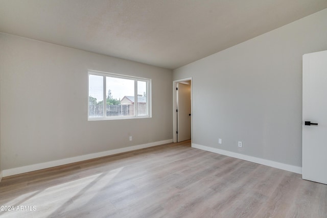 spare room with light hardwood / wood-style flooring