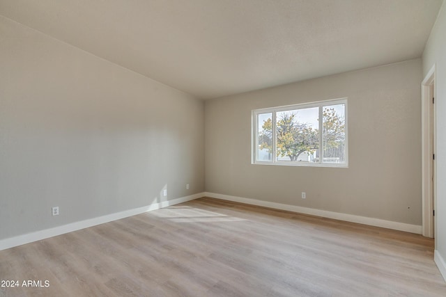 spare room with light hardwood / wood-style flooring