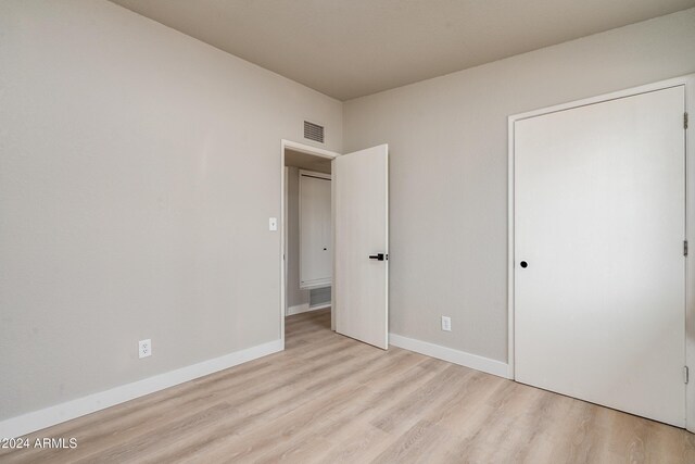 unfurnished bedroom with light hardwood / wood-style floors