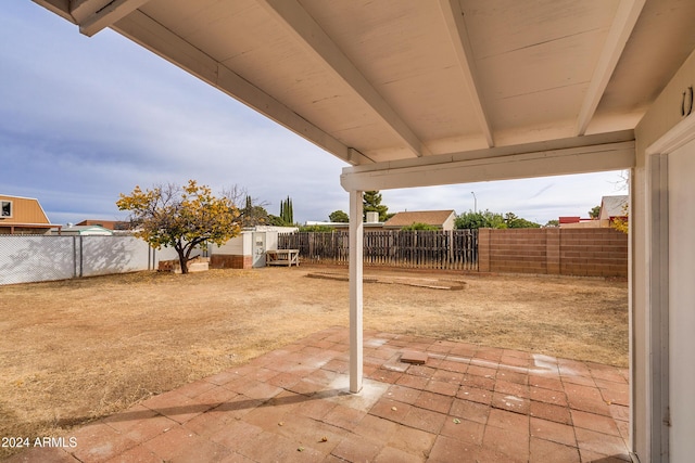 view of patio / terrace featuring a storage unit