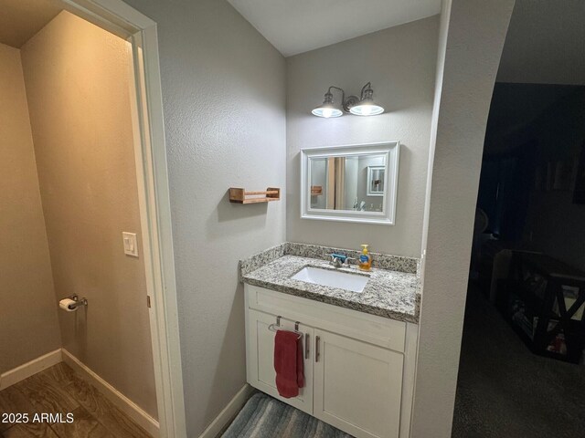 8520 W Palm Ln Unit 1054, Phoenix, AZ 85037 - bathroom featuring vanity and wood finished floors