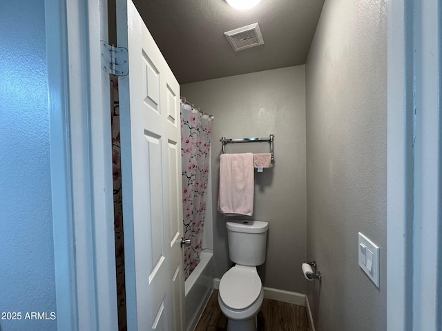 8520 W Palm Ln Unit 1054, Phoenix, AZ 85037 - bathroom featuring wood finished floors and shower / tub combo with curtain