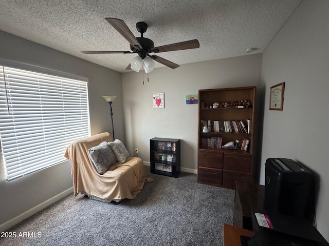8520 W Palm Ln Unit 1054, Phoenix, AZ 85037 - sitting room with a ceiling fan, carpet floors, and a textured ceiling