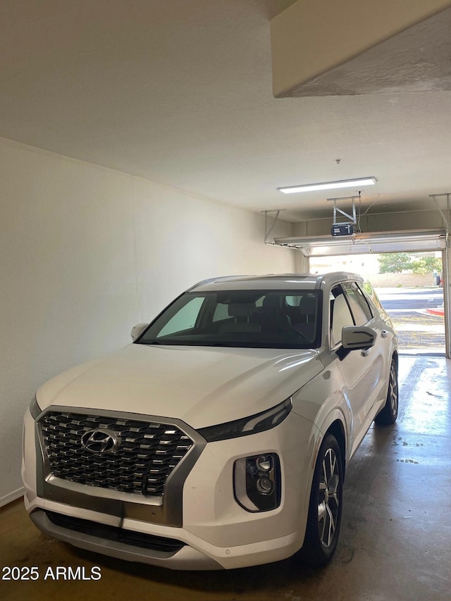 14575 W Mountain View Blvd Unit 711, Surprise, AZ 85374 - garage featuring a garage door opener