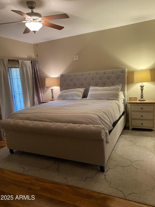 14575 W Mountain View Blvd Unit 711, Surprise, AZ 85374 - bedroom featuring light wood-style flooring and ceiling fan