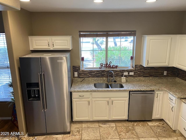 14575 W Mountain View Blvd Unit 711, Surprise, AZ 85374 - kitchen with appliances with stainless steel finishes, a sink, backsplash, white cabinetry, and recessed lighting